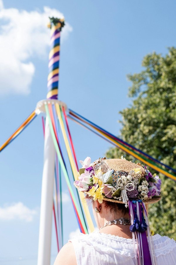 Where can you experience a traditional Maypole dancing event in rural England?